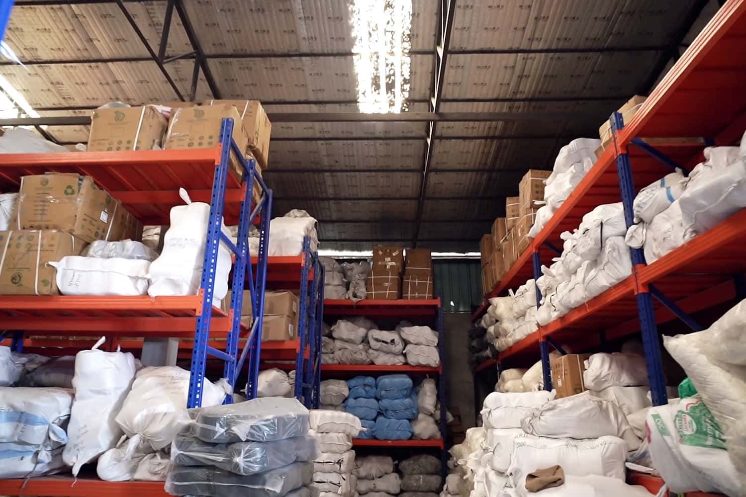 Packed bundles of stock on a warehouse rack, ready to dispatch